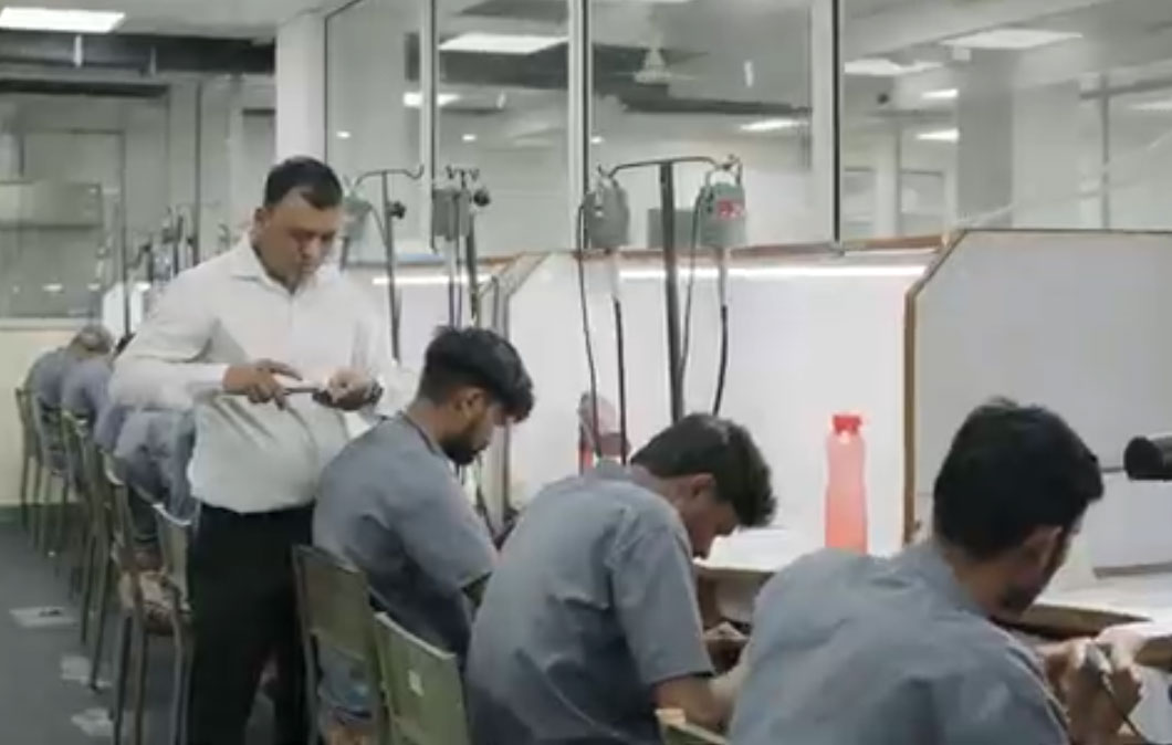 Busy jewelry factory workspace